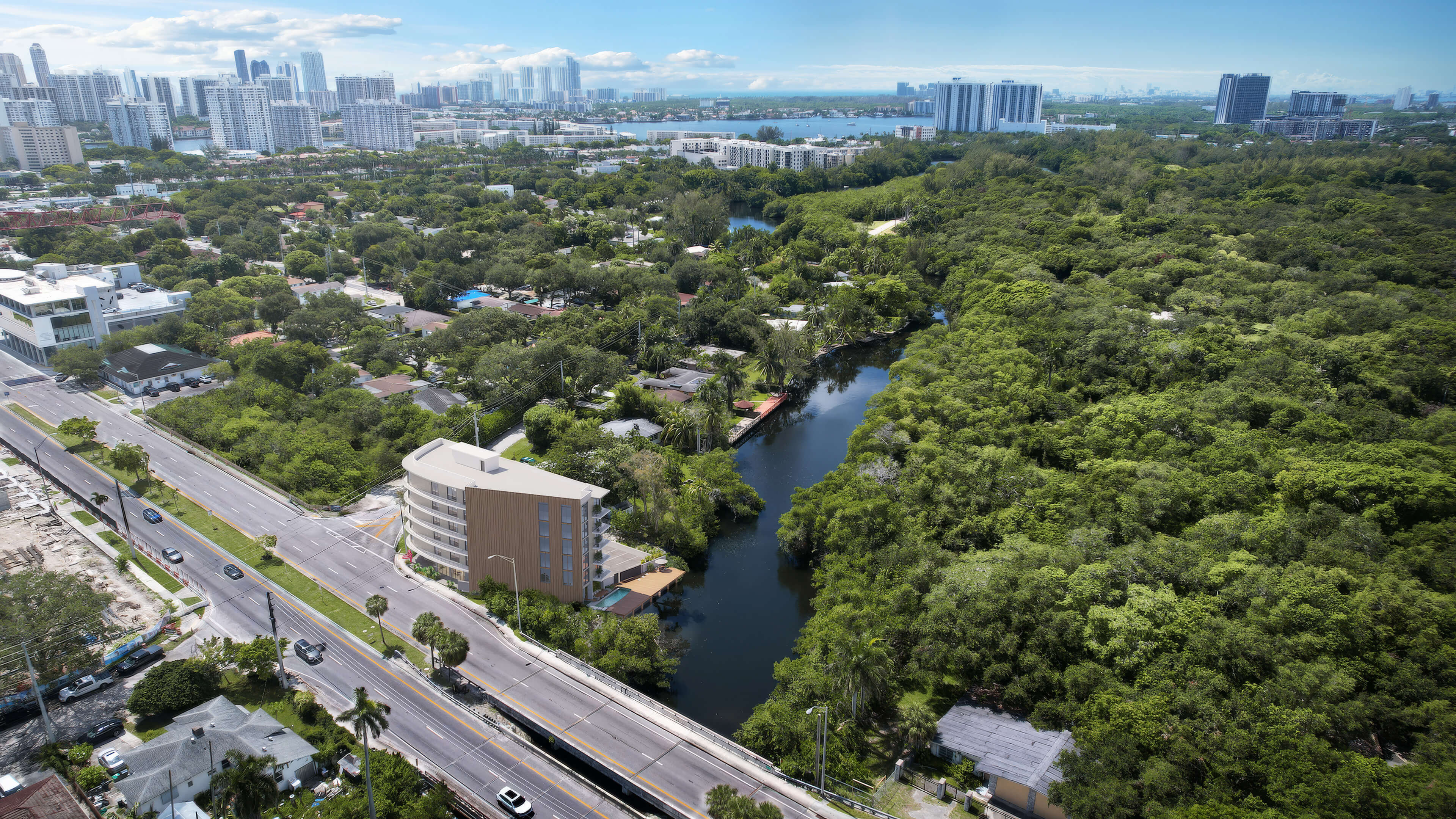 Aerial location view of Canal by IQ near the canal, green preserve and city skyline