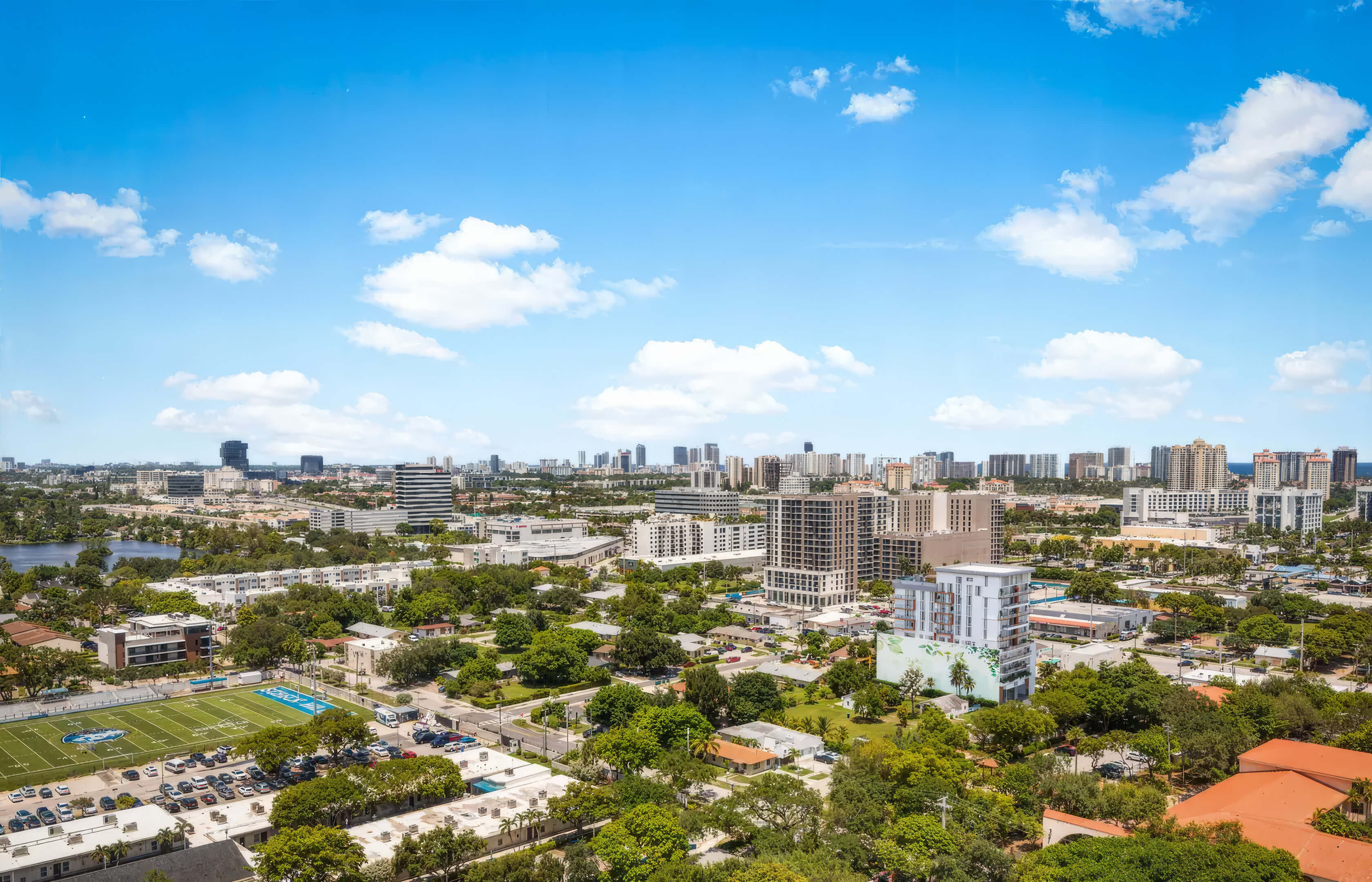 Skyline views from EDEN Residences in Aventura overlooking the city, greenery and nearby coastline