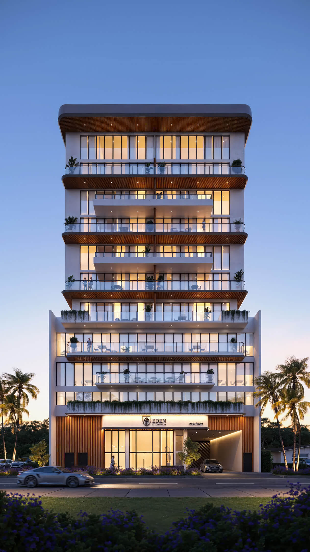 Modern evening exterior view of EDEN Residences with glass balconies and luxury architecture
